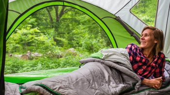 woman laying down with sleeping bag