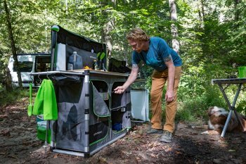 Men using camp kitchen campsite